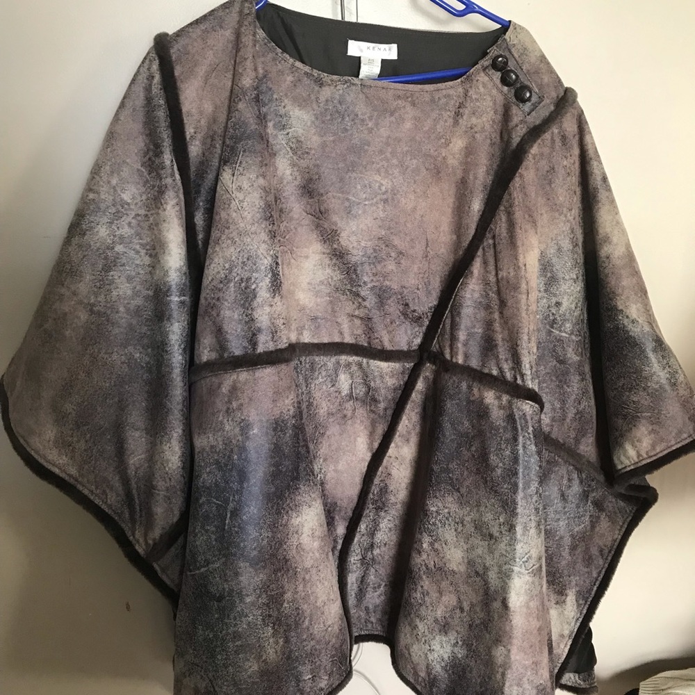 Brown cape with pocketbook.